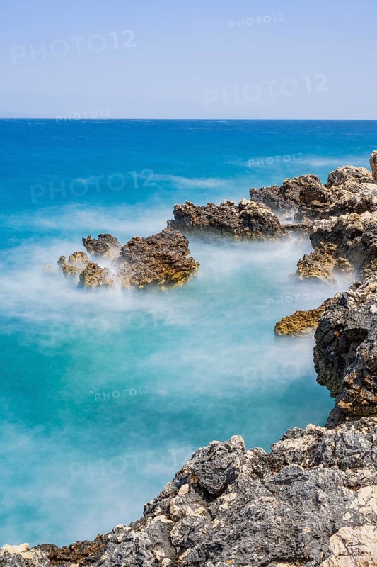 Romantic view over the sea in Koromacna Bay on a sunny day with rough seas on the island of Cres, long exposure, Croatia