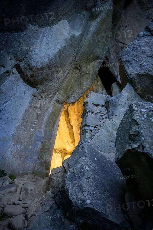 Incidental sun illuminates the passage (Chambre du Roi) through the high rocks, hike through the sandstone labyrinth Grés d'Annot, Alpes-de-Haute-Provence, France