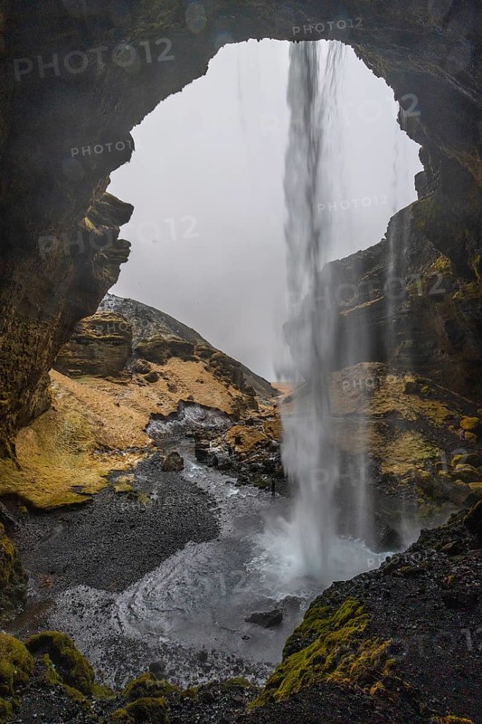 Waterfall from behind, lava rock canyon, winter, Kvernufoss, Skogar, Iceland, Scandinavia