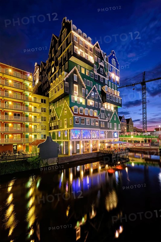 ZAANDAM, NETHERLANDS, MAY 21, 2018: Inntel Hotel in Zaandam illuminated at night. Design of 12-storey tall building opened in 2009 is the result of stacking a series of traditional Dutch houses