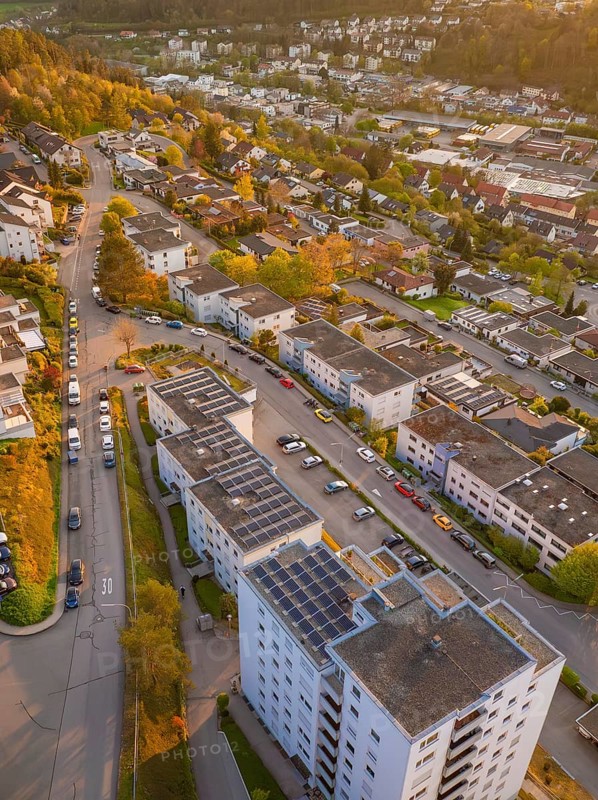 Town view with numerous residential buildings and streets, in warm evening light, Nagold, Black Forest, Germany