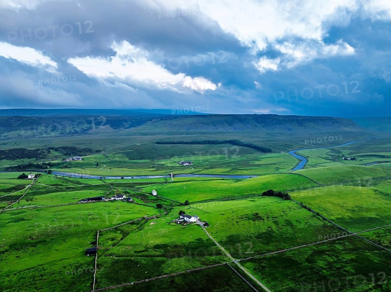 Forest in Teesdale over River Tees from a drone, North Pennines AONB, County Durham, England, United Kingdom