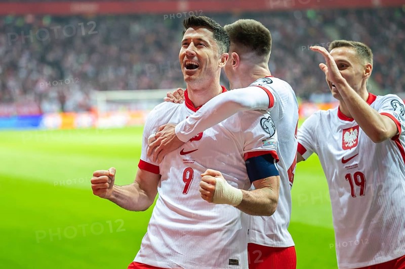 WARSAW, POLAND - MARCH 21, 2025: Qualifications for FIFA 2026. Match Poland - Lithuania 1:0. Joy Robert Lewandowski (L) Krzysztof Piatek, Przemyslaw Frankowski (R) team of Poland after scoring goal
