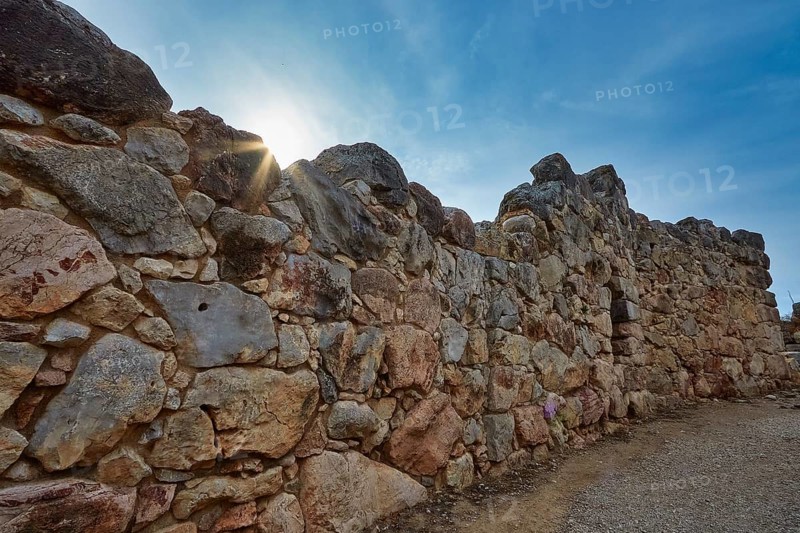 Old stone wall at sunrise creating a historic atmosphere, Tiryns, ancient city in Argolis, Mycenaean, Peloponnese, Greece