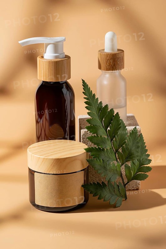 Stylish cosmetic bottles with wooden lids against a minimal beige background. The composition highlights natural beauty and sustainable packaging, with a touch of elegance