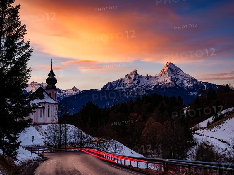 Watzmann and the pilgrimage church of Maria Gern at dawn, traces of light on the road in the foreground, long exposure, Berchtesgaden, Berchtesgadener Land, Upper Bavaria, Germany