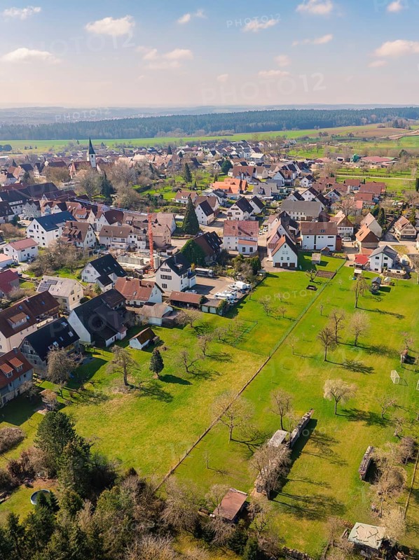 Village surrounded by large green spaces and scattered trees that emphasise the rural ambience, Nagold Hochdorf, district of Calw, Germany