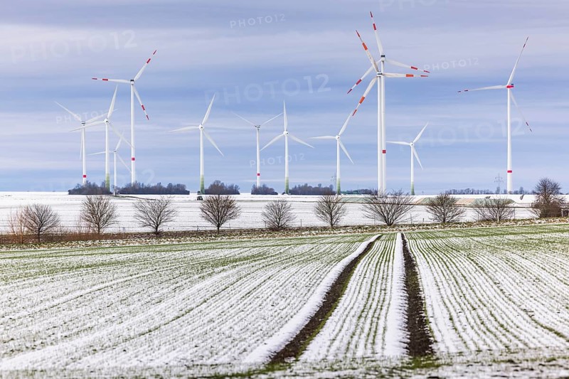 Wind farm in snowy landscape, Gevensleben, Lower Saxony, Germany