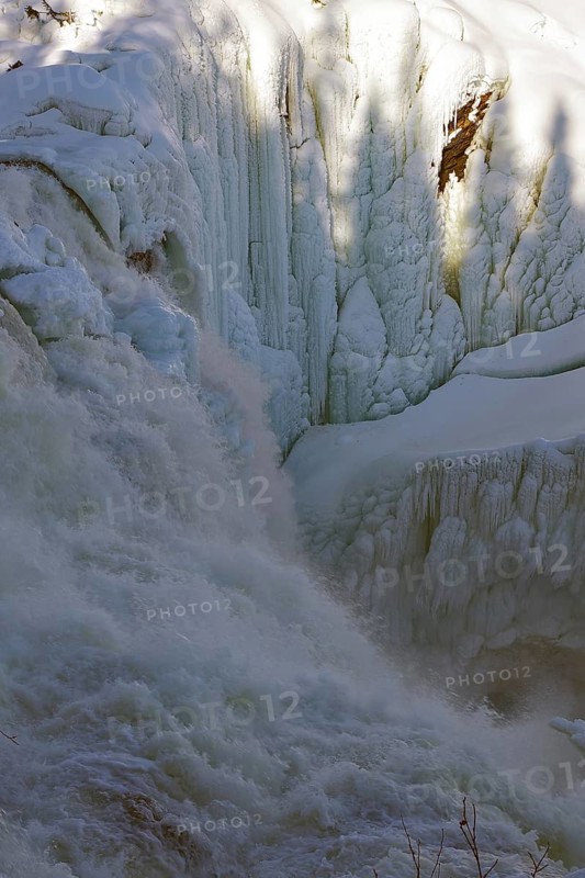 Waterfall partly frozen, with ice structures and shadows on the snow, winter, Sweden's highest waterfall, Tännforsen, Åreälven, Are, Jämtland, Sweden