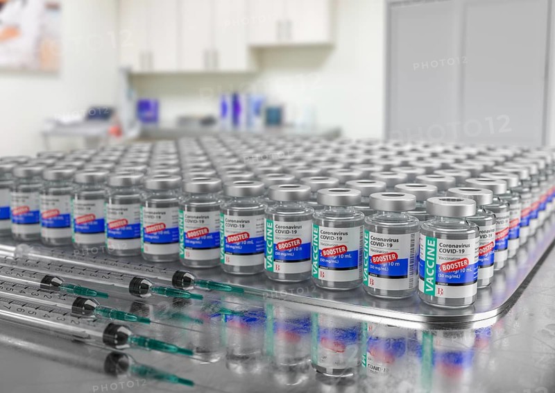 Hundreds of Coronavirus COVID-19 Vaccine Booster Vials and Syringes In Medical Office