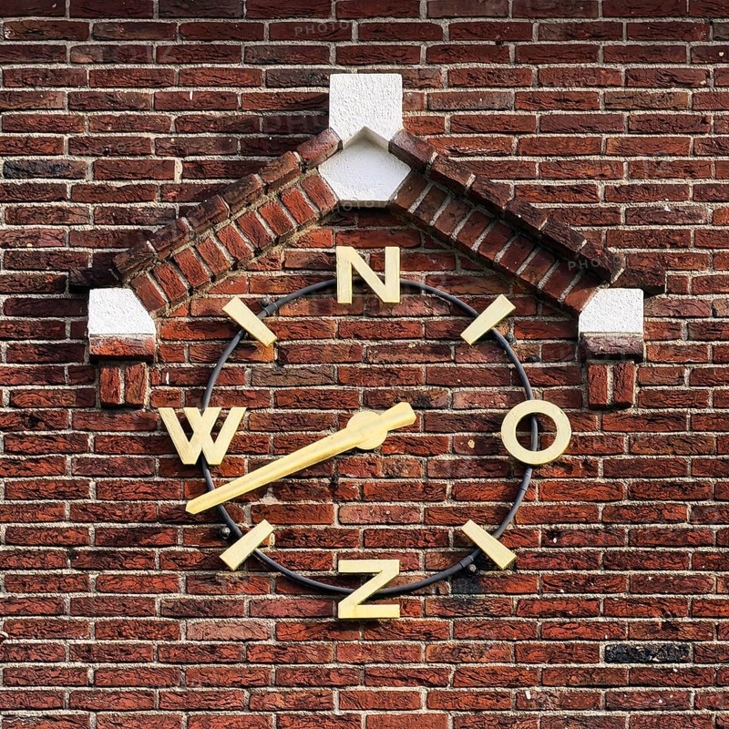 Wind clock on brick wall, Roermond, Limburg Province, Netherlands