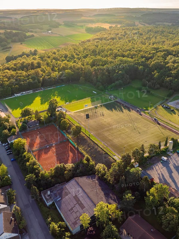 Aerial view of a sports field with football pitches and tennis courts, surrounded by woods and fields, Gechingen, Black Forest, Germany