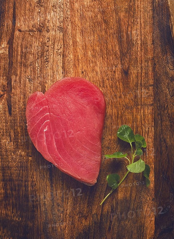 Fresh red tuna fillet, for steak, raw, top view, on a cutting board, no people