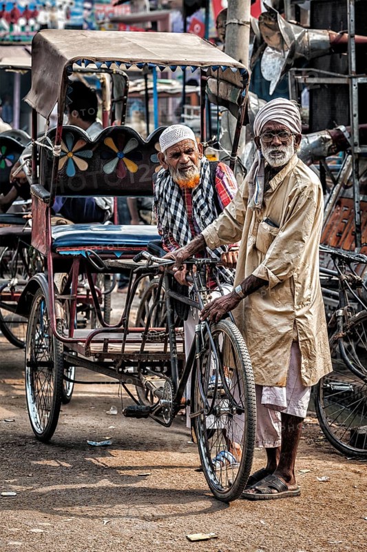 AGRA, INDIA, NOVEMBER 21, 2012: Bicycle rickshaws in the street of Agra, Uttrar Pradesh, India