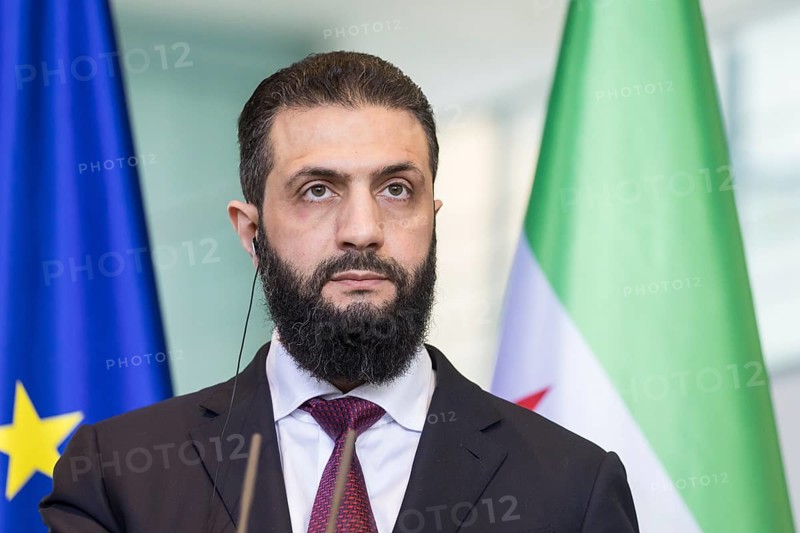 Ahmed al-Sharaa (President of the Syrian Arab Republic) at a joint press conference with Friedrich Merz (Chancellor of the Federal Republic of Germany, CDU) after a one-on-one meeting at the Federal Chancellery, Berlin, 30 March 2026