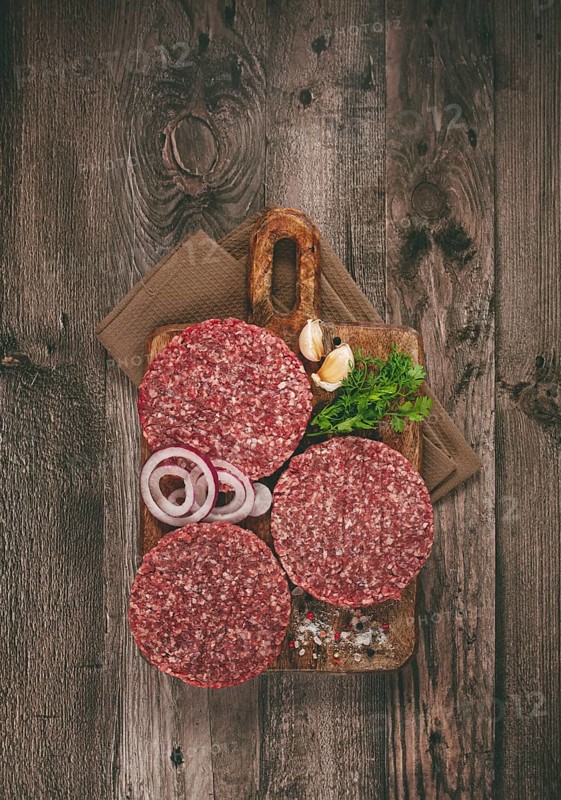 Raw cutlets, for burgers, minced meat, handmade, homemade, with spices, top view, no people