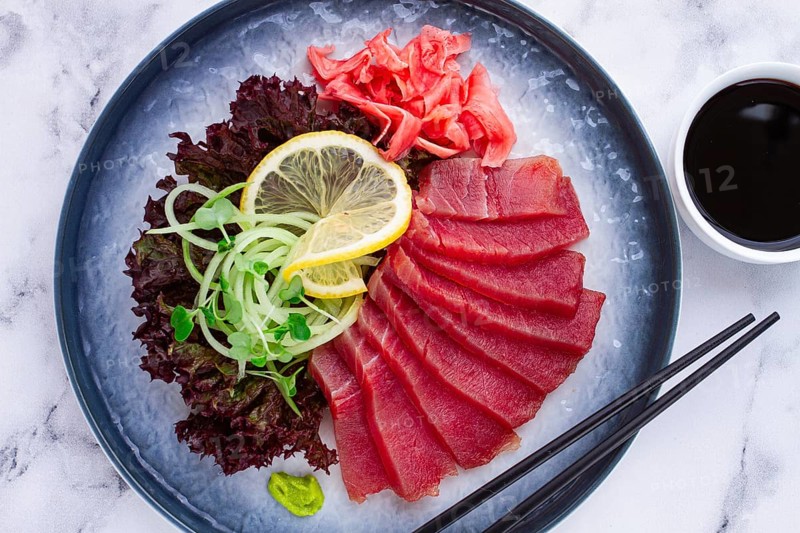 Tuna sashimi, with side dish, on a marble table, homemade, no people