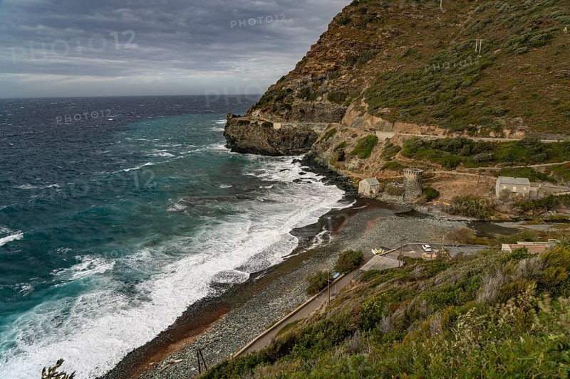 Beach and Genoese tower of La Marine de Negru on the west coast of Cap Corse, Corsica, France