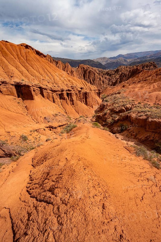 Eroded mountain landscape with sandstone cliffs, canyon with red and orange rock formations, Konorchek Canyon, Chuy, Kyrgyzstan