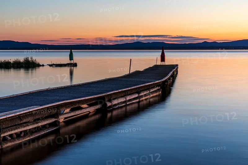 Long boat dock at dusk on Lake Siljan near Nusnäs, Dalarnas län, Sweden