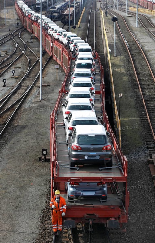 Wolfsburg, DEU, 250211 - Car transport wagons with new Volkswagen Golf and Tiguan vehicles on the Volkswagen factory premises, Wolfsburg, Germany