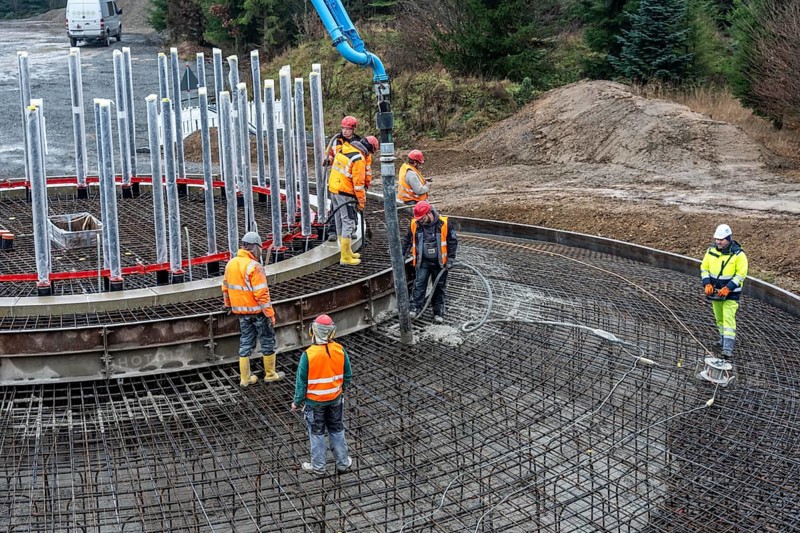 Concreting, concreting the foundation of a wind turbine, more than 600 cubic meters of concrete will be pumped into the foundation for over 7 hours, over 100 tons of reinforcing steel have been used, the wind turbine will have a hub height of 160 meters, part of a new wind farm in Sauerland, near Balve, North Rhine-Westphalia, Germany