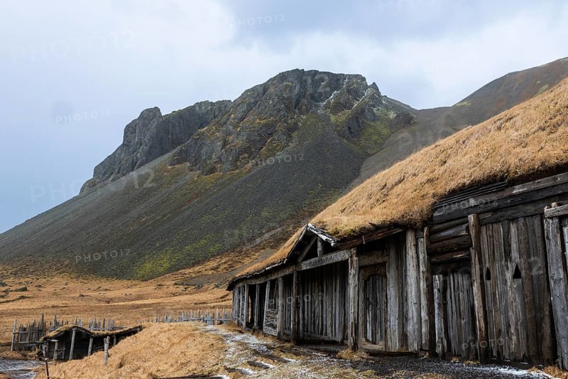 Wickinger buildings against mountain backdrop, winter, Stokksnes, Vestrahorn, Klifatindur, Höfn, Iceland, Scandinavia