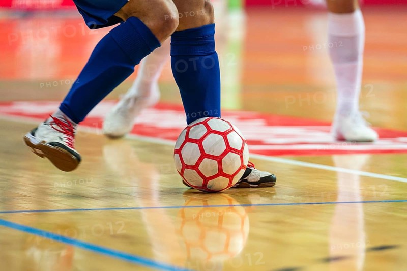 Detail of futsal ball and players legs in Lubin, Poland
