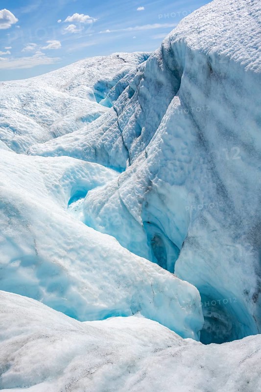 Waterfall in a crevasse on the ice of Root Glacier, Wrangell St. Elias National Park, Alaska, USA