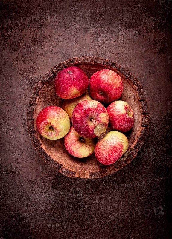 Apples in a wooden bowl, top view, yellow - red, summer variety, early, no people