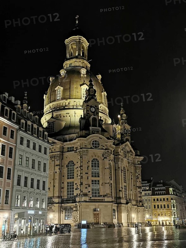 Illuminated Church of Our Lady in Dresden at night, surrounded by historic buildings, Dresden