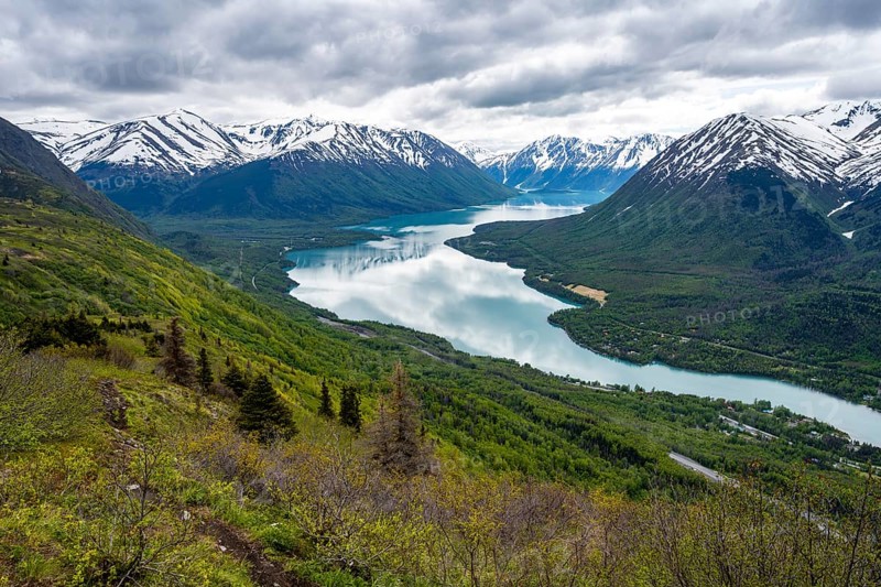 View of snowy mountains and turquoise lake Kenai Lake, Slaughter Ridge Trail, Cooper Landing, Kenai Peninsula, Alaska, USA