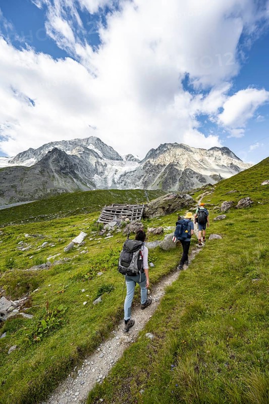 Mountaineer on a hiking trail, mountain landscape near Arolla, behind glacier Glacier de Tsijore Nouve, Valais, Western Alps Switzerland