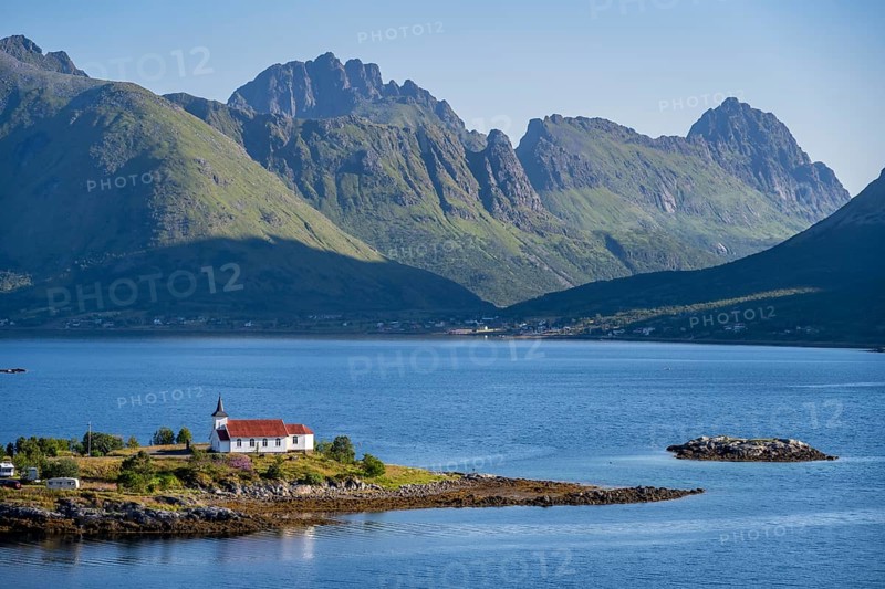 Small church Sildpollnes Kirke at the fjord Austnesfjorden, idyllic Norwegian fjord landscape, Sildpollen, Nordland, Norway