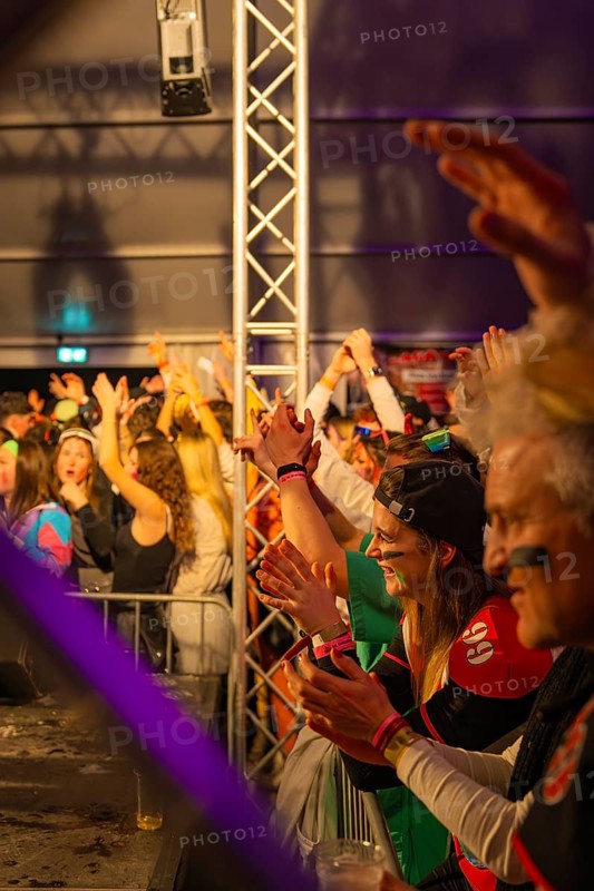 Cheerful people celebrate with colourful lights on a party stage, carnival, Schlagerkuchen Donzdorf, Göppingen district, Germany