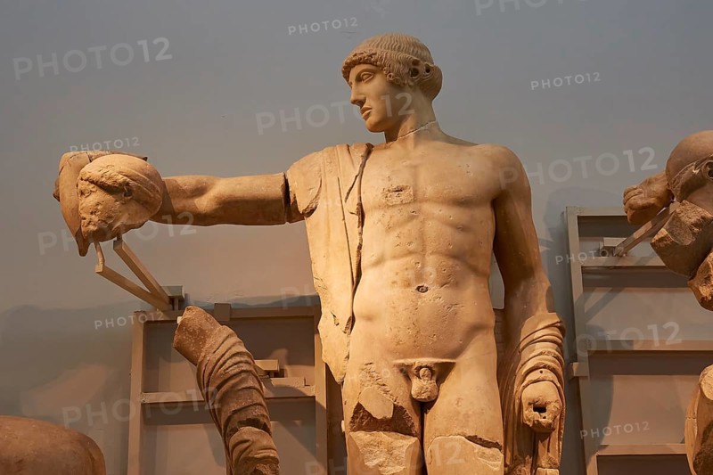 West pediment of the temple of Zeus, battle between lapiths and centaurs, statue of Apollo, ancient Greek marble sculpture of a man who was probably holding a bow, Olympia Archaeological Museum, Ancient Olympia, Olympia, Peloponnese, Greece