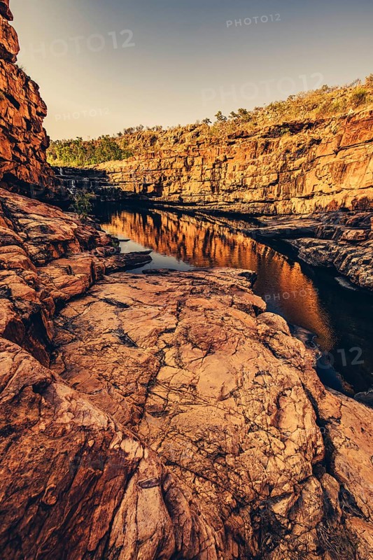 Bell Gorge waterfall, a body of water in north-west Australia in the Kimberley. Sunrise in the outback, Australia