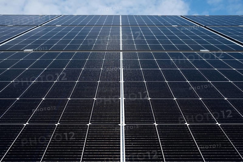 Photovoltaic panels close up with blue sky above
