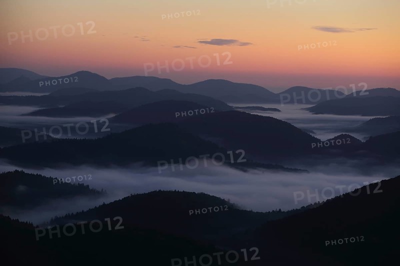 Landscape with mountains and clouds of fog in front of sunrise, nature photography, blue hour, night view, twilight, fog landscape, Wegelnburg, Dahner Felsenland, Rhineland-Palatinate, Germany