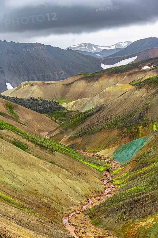 Small river between colourful rhyolite mountains, volcanic landscape, erosion landscape, Landmannalaugar, Fjallabak Nature Reserve, Icelandic Highlands, Suðurland, Iceland
