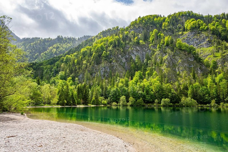 Landscape of Lake Offensee after rain when the sun comes through the clouds in spring, Salzkammergut, Austria