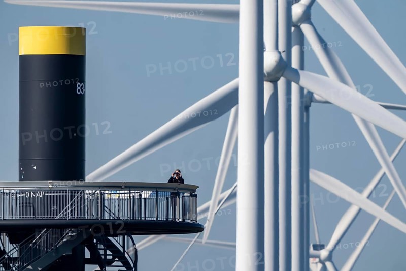 Viewing platform at Landtong Rozenburg wind farm, Noordzeeweg, Paal 83 watchtower 22 meters high, behind it 11 Vestas wind turbines, with an output of 34 MW and an annual result of 117 gigawatts, which corresponds to the consumption of approximately 43, 000 households, on a promontory on Nieuwe Waterweg, at Europoort harbour, hub height 130 meters, rotor diameter 26 meters, near Rotterdam, the Netherlands
