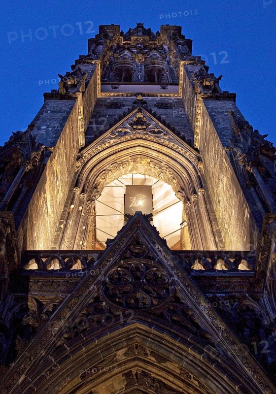Illuminated church tower of the St. Nikolai memorial, ruins of the former main church of St. Nikolai, Hamburg, Germany