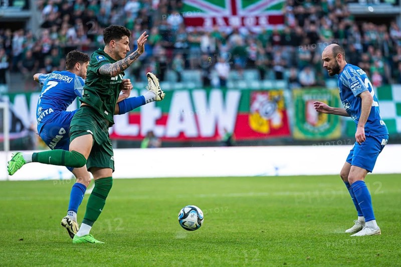 WROCLAW, POLAND - APRIL 27, 2024: Football match Polish PKO Ekstraklasa between Slask Wrocla vs Ruch Chorzow. Supporters of Slask. In action Erik Exposito (L) and Filip Starzynski (R).