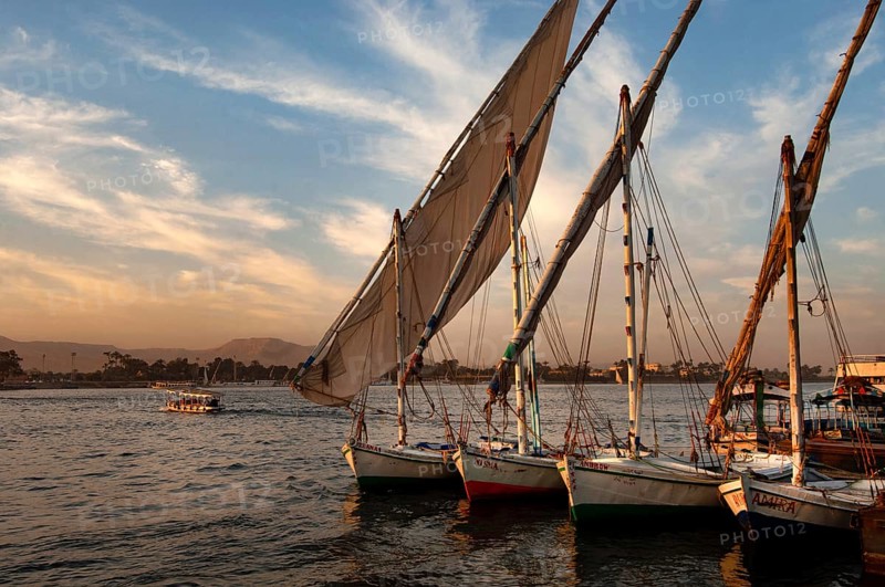Luxor, Egypt. February 11th 2009 Felucca sail boats moored along side the River Nile at Luxor, Egypt