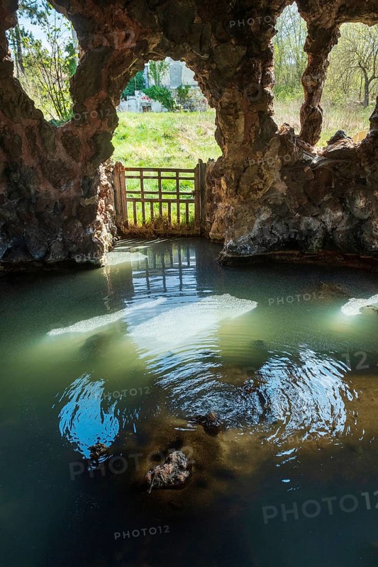 Well-sheltered Valois Spring or Cave Spring in the ancient thermal park. Sainte Marguerite, Saint Maurice es Allier, Puy de Dome, France