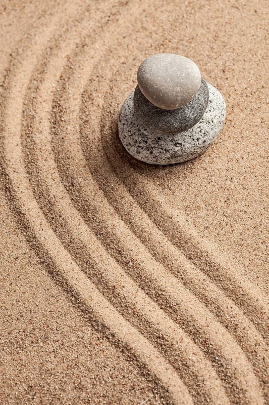 Japanese Zen stone garden, relaxation, meditation, simplicity and balance concept, pebbles and raked sand tranquil calm scene