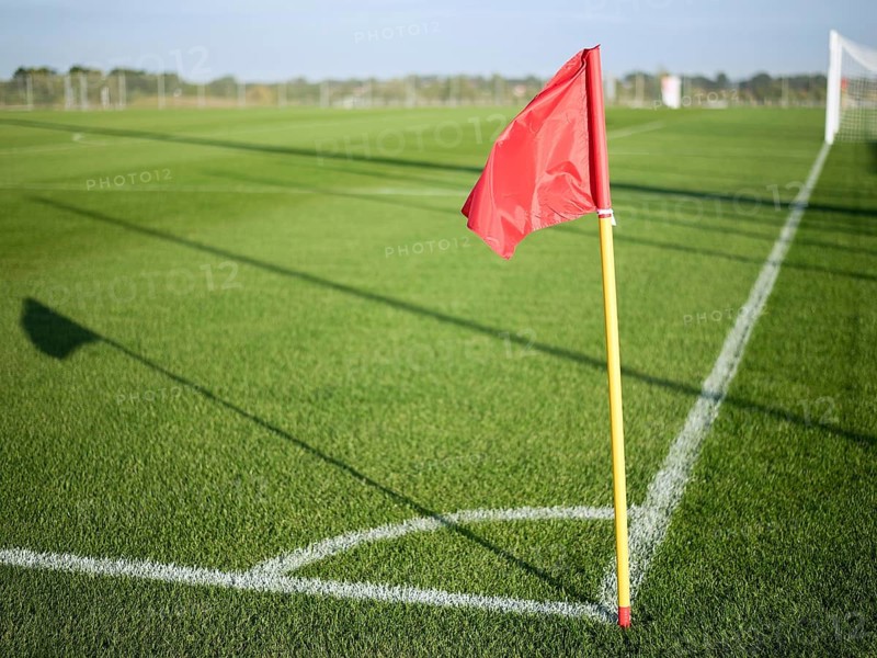 Red flag in corner of football playground