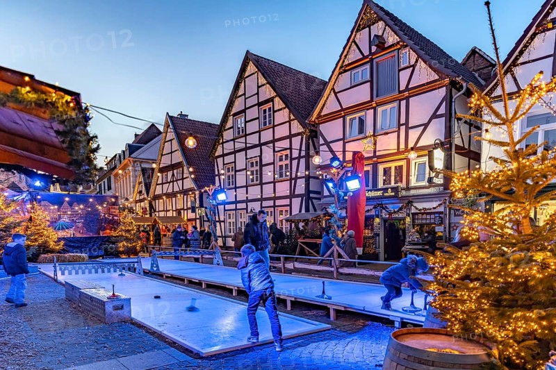 Curling at the Christmas market and timbering in Soest at dusk, North Rhine-Westphalia, Germany