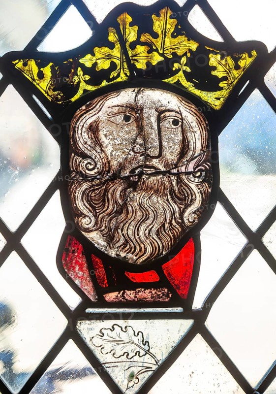 Stained glass window depiction of medieval man face, Bristol cathedral church, Bristol, England, UK